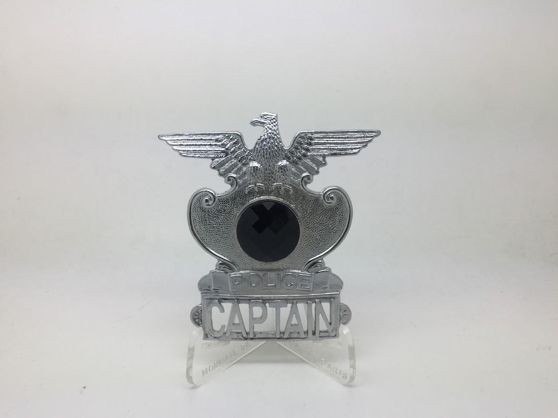 Michael Jackson Worn Custom Made Badge: Title: Michael Jackson Worn Custom Made Badge Provenance: A custom-made mounted silver, military Style badge reading "Police Captain" with central round jet swarovski stone. Michael Jackson has been p