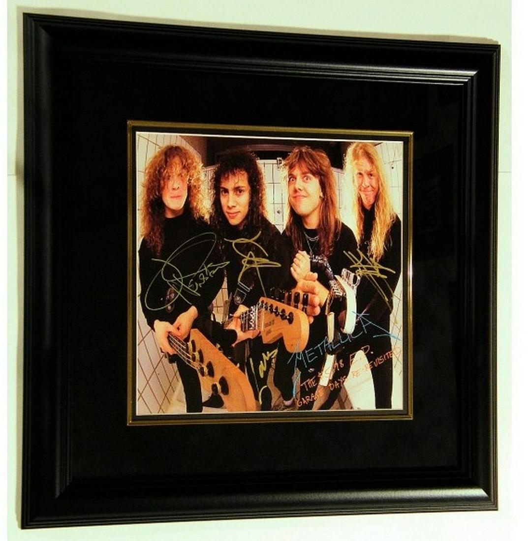 Metallica "Garage Days Revisited" 1987: Title: Metallica "Garage Days Revisited" 1987 Materials: Black Frame with UV Glass and Suede Matting Dimension: 21 1/2 x 21 1/2 Inch Provenance:Signed: Lars Ulrich, Kirk Hammett, Jason Newsted and Jam