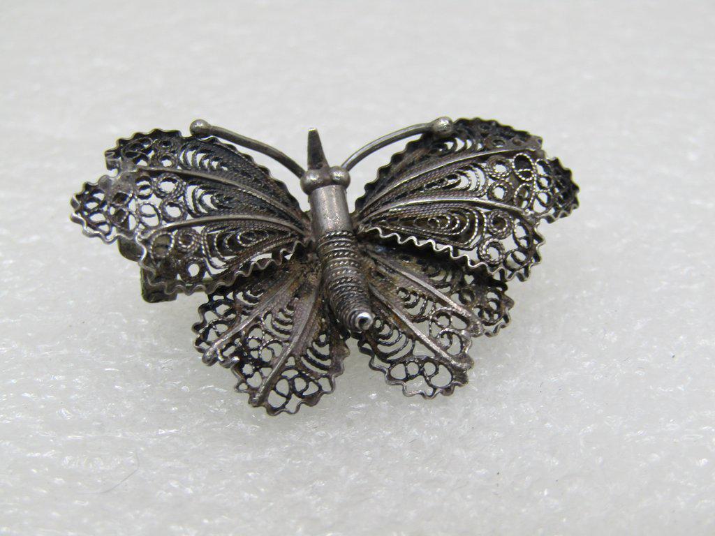 Vintage .800 Sterling Butterfly Brooch, Filigree, 4.65: Vintage .800 Silver Butterfly Brooch, filigree, 4.65 grams and 1.5" wide and 1" tall from the 1930's-1940's, with a C-Clasp. It has vintage oxidation that can be polished to bright and shiny if desire