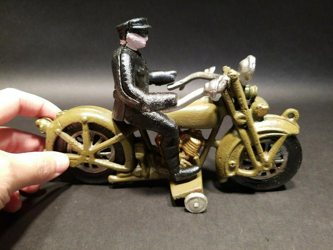 Cast Iron Toy Motorcycle 1 Police Patrol Rider: 8 1/2" Long x 6" Tall with the rider Such a neat reproduction cast iron motorcycle ! As you can see this heavy cast iron pull toy motorcycle was wonderfully hand painted and distressed to look like an