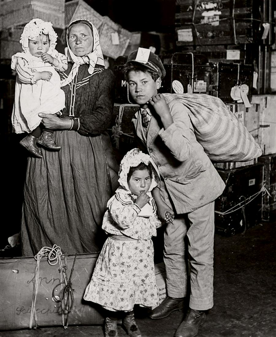 LEWIS W. HINE - Italian Family Seeking Baggage, 1905: Artist: HINE, LEWIS W. Title: Italian Family Seeking Lost Baggage, Ellis Island, 1905 Medium: Sheet Fed Gravure, 1964, Netherlands Dimensions: 4.9x6.8" Artist Bio: Lewis Wickes Hine (1874 - 1940) was