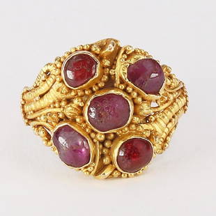 Five Ruby and Gold Ring: Five Ruby and Gold Ring; A small gold granulated ring set with five cabochon rubies. The shank and skeleton of the ring made up from fused gold wire. Reserve: $1,200.00 Shipping:Domestic: Flat-rate
