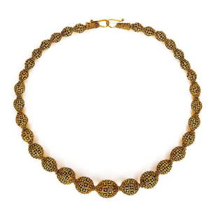Gold granulated bead necklace: Gold granulated bead necklace; A fine gold necklace of 31 graded beads pierced and granulated. The quality of the piercing and granulations speaks to the excellence of the goldsmiths that were of