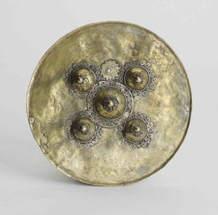 Gold Pectoral: Gold Pectoral; Head hunting warriors were often presented with these pectorals. They were also presented at marriage negotiations. These discs are seen as cosmic symbols and represent the sun and