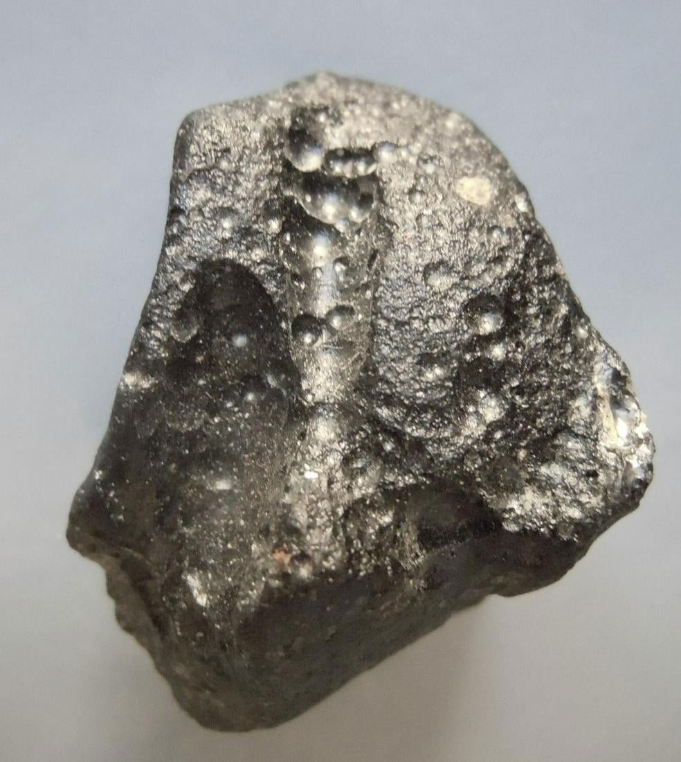 PHILIPPINITE TEKTITE - FROM METEORITE IMPACT: Title: PHILIPPINITE TEKTITE - FROM METEORITE IMPACT Origin: Paracale, Camarines Norte, Luzon, Philippines Size: 2.5x2x1.5 cm / 12 gram Description: deeply untercut, mushroom shaped rizalite/philippini