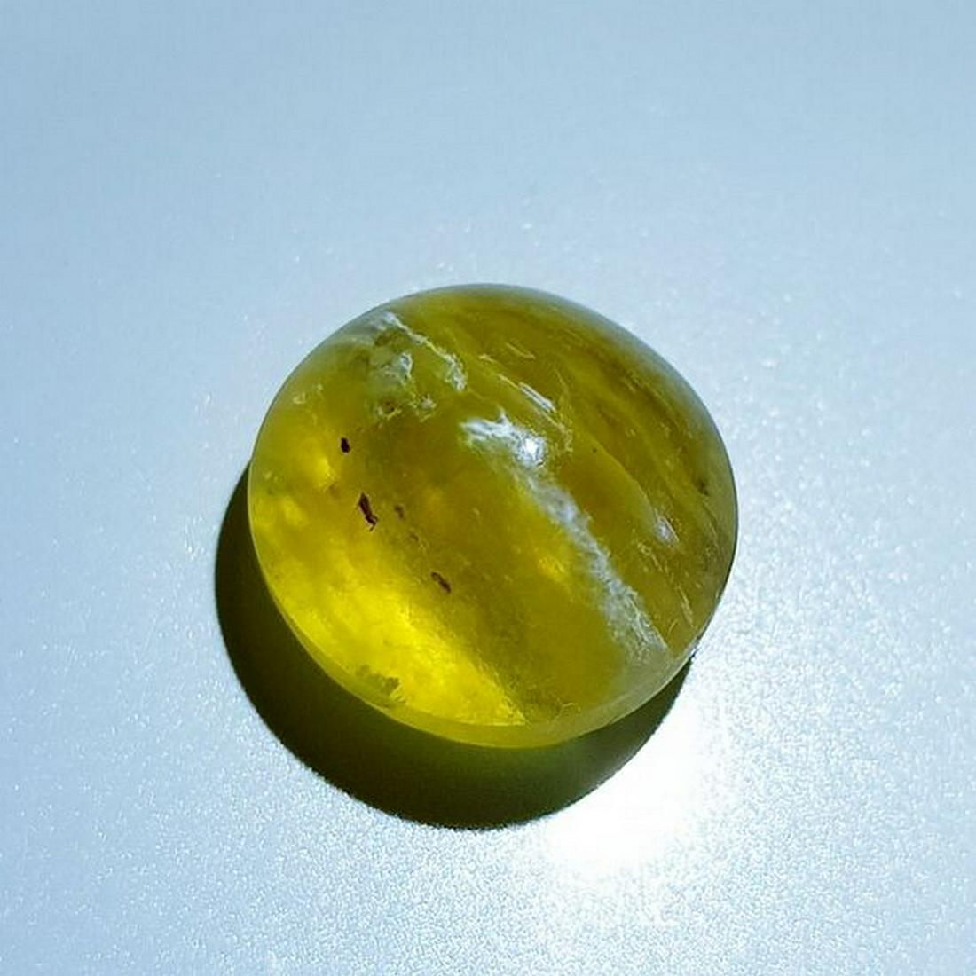 6.25 ct Natural Opal Cat's Eye: No Reserve! Title: 6.25 ct Natural Opal Cat's Eye Color/Clarity: Semi Transparent Gemstones: Loosegemstone Carat Weights: 6.25 Size/Dimensions: 12.10 x 12.10 x 7.50 Additional Information: Round - Afr