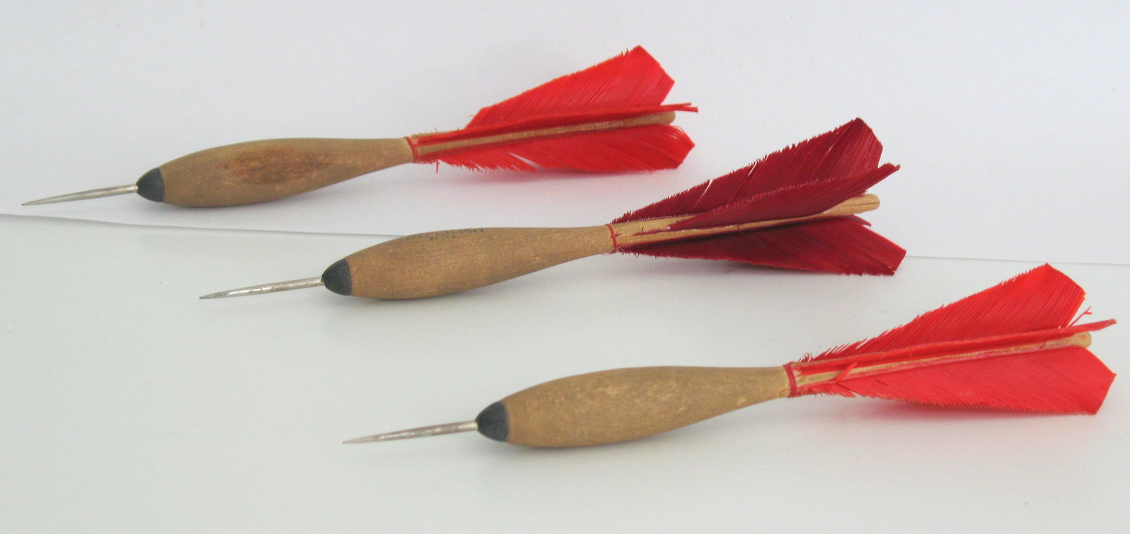 Three Vintage Turkey Feather Darts.: Title: Three Vintage Turkey Feather Darts. Date/Period: 1950's Dimension: 7 1/2” Provenance:Group of three vintage turkey feather darts. Shipping: Domestic: Flat-rate of $15.00 to anywhere within th