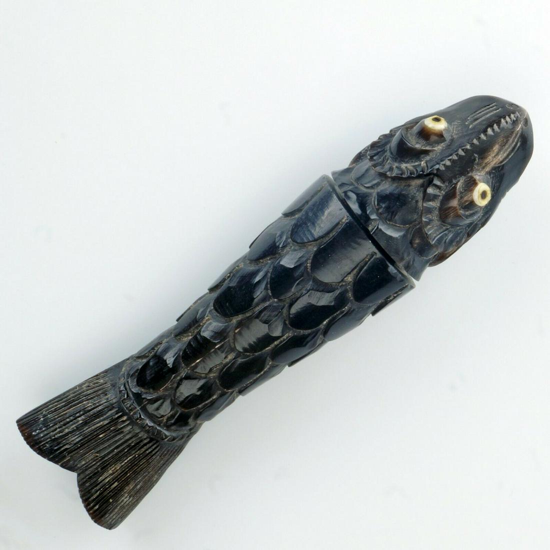 Vintage Chinese Carved Horn Needle Fish Case: Fun, well carved case made from horn, with white eyes and black pupils. It might have been for storing needles but we've also heard from people telling us that it's a vintage (over 20 yrs old) replica