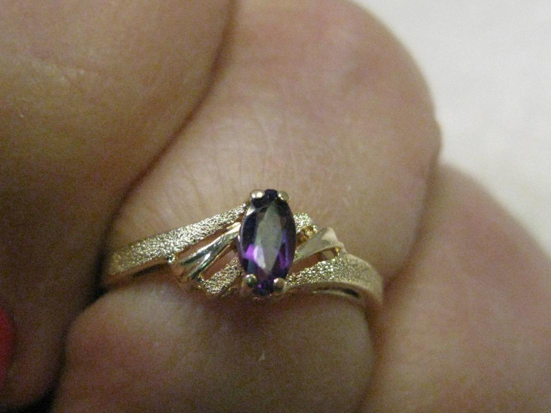 Vintage 14kt Gold Marquis Amethyst Ring, sz. 5.5,: Vintage Jewelry: Vintage 14kt Gold Marquis Amethyst Ring, size 5.5, signed ROR, weight is 1.42 gr. It has a tiered band that rises at the sides up toward the stone that sits higher - the band is both