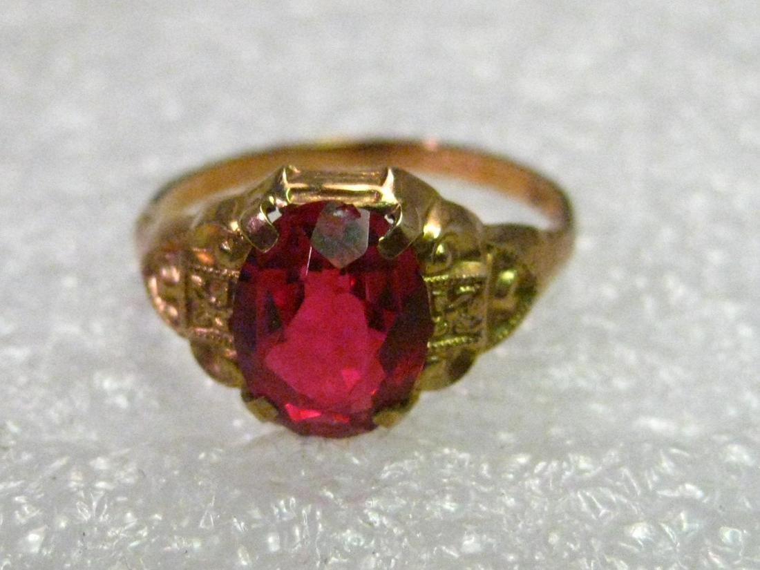 Vintage Art Deco 10kt Gold Bright Red 1.25 ctw Spinel: Vintage Jewelry: Art Deco 10kt yellow gold spinel - size 3. 1.02 grams. The stone is 7.5 mm by 5.8 mm and appx 3.7 mm deep, appx. 1.25ctw. The ring is in an art deco setting with a stamped design on e