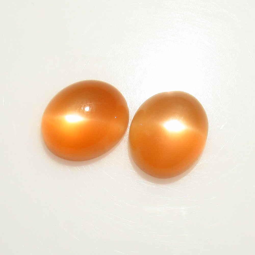 10.36 Ctw Natural Orange Moonstone Oval Pair: Title: 10.36 Ctw Natural Orange Moonstone Oval Pair Stone Clarity: Transparent Gemstones: Moonstone Carat Weights: 10.36 Size/Dimensions: 11.90 x 10.00 x 6.10 mm / 2 PC's Additional Information: Nice