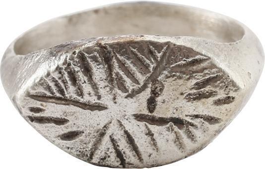 ANCIENT MEDIEVAL EUROPEAN RING 7th-10th century. SIZE 5: 7th-10th century. Size 5 1/2 with ridged face band flaring to the shoulders. Pointed oval bezel cut with and abstracted semi symmetrical pattern, probably serving as a signet ring to seal wax and clay