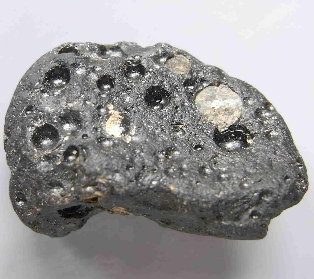 PHILIPPINITE TEKTITE - FROM METEORITE IMPACT: Title: PHILIPPINITE TEKTITE - FROM METEORITE IMPACT Origin: Paracale, Camarines Norte, Luzon, Philippines Size: 3x2x1.5 cm / 10 gram Description: half moon shaped rizalite/philippinite tektite with bi