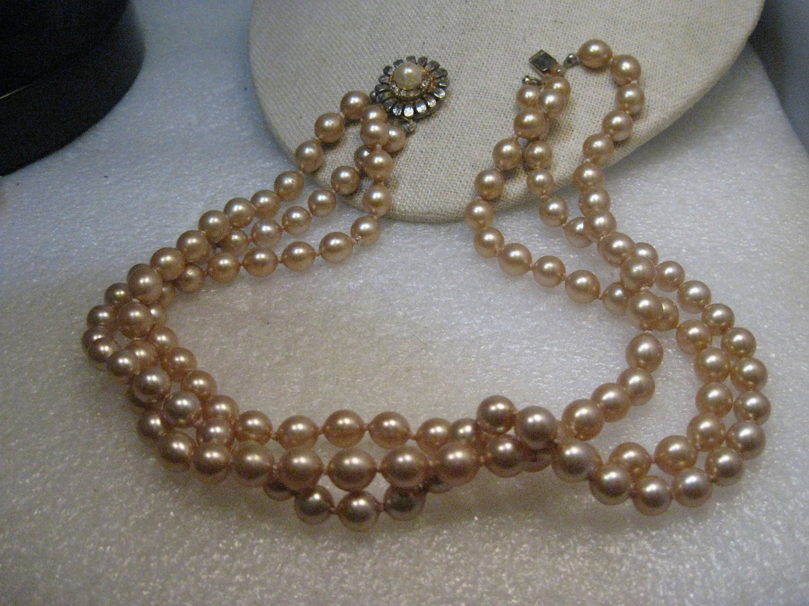 Vintage Triple Strand Pearl Necklace, 7.5mm, Knotted,: Vintage Triple Strand Champagne Pearl Necklace, 7.5mm pearls and 16.5" long, baroque pearls, blossom box clasp with rhinestones - two rhinestones were missing and have been replaced. The pearls are kn