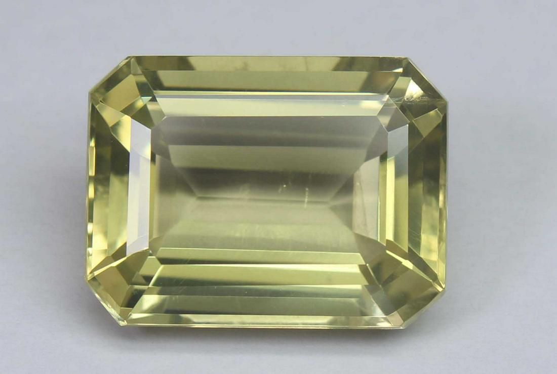 18.30 Ct Natural Lemon Quartz: No Reserve! Title: 18.30 Ct Natural Lemon Quartz Additional Information: Gemstone : Natural Lemon QuartzWeight : 18.30 CtsShape : Emerald CutColour : Greenish Yellow Dimensions : 18.7x14.1x9.1 mmOrigi