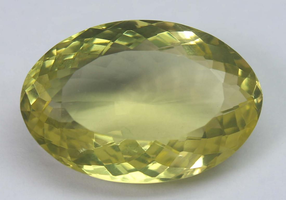 18.78 Ct Natural Lemon Quartz: No Reserve! Title: 18.78 Ct Natural Lemon Quartz Additional Information: Gemstone : Natural Lemon QuartzWeight : 18.78 CtsShape : Oval CutColour : Greenish Yellow Dimensions : 22x15.4x8.9 mmOrigin : A