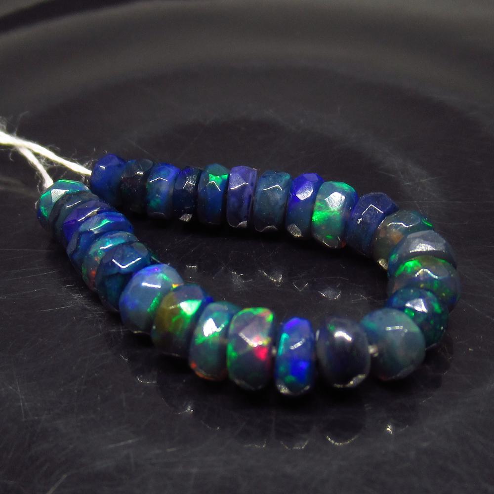 5.11 Ct Natural 27 Drilled Faceted Fire Black Opal: No Reserve! Title: 5.11 Ct Natural 27 Drilled Faceted Fire Black Opal Beads Color/Clarity: Translucent Gemstone: Natural Faceted Black Opal Beads Carat Weight: 5.11 Size/Dimensions: 3.70 to 4.40 mm / 