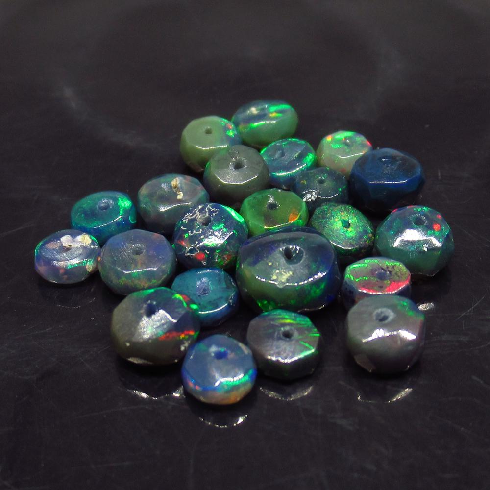 5.81 Ct Natural 25 Drilled Faceted Fire Black Opal: No Reserve! Title: 5.81 Ct Natural 25 Drilled Faceted Fire Black Opal Beads Color/Clarity: Translucent Gemstone: Natural Faceted Black Opal Beads Carat Weight: 5.81 Size/Dimensions: 3.80 to 6.30 mm / 