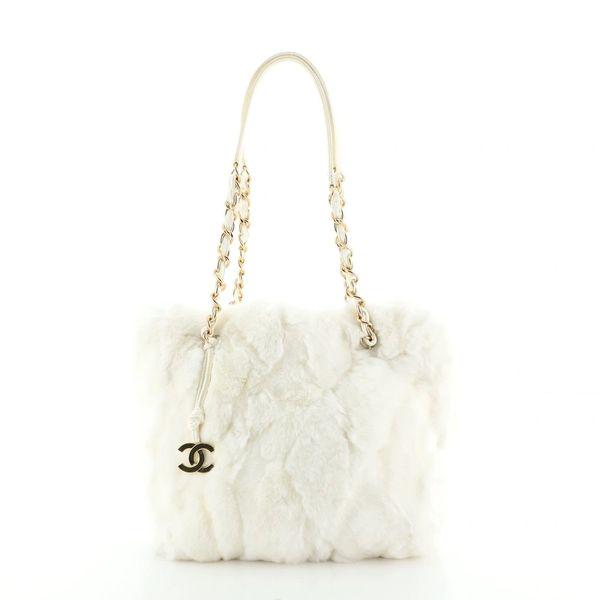 Chanel Vintage Winter White Lapin Fur Shoulder Tote Bag: We offer this Chanel Vintage Winter White Lapin Fur Chain Tote Bag. The prettiest Chanel bag ever, is crafted from white fur, features a woven-in leather chain shoulder strap, and gold-tone hardware.