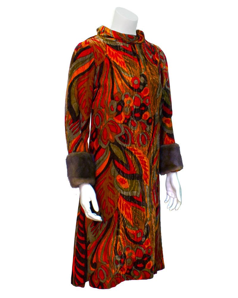 Teal Traina Orange printed velvet dress with mink cuffs: Early 1960s cocktail dress by Teal Traina. Dress is made from stunning velvet full of rich fall tones of orange, brown and green in an abstract floral print. Mock turtleneck collar and cute mink cuffs