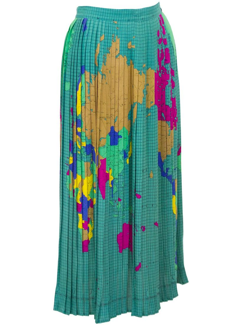 Fiorucci Multi Colour World Map Pleated Skirt: Unique and hard to find Fiorucci pleated skirt from the 1970s. The skirt features an allover pattern of the map of the world in vibrant jewel tones. Fastens in the back with a zipper and button on the