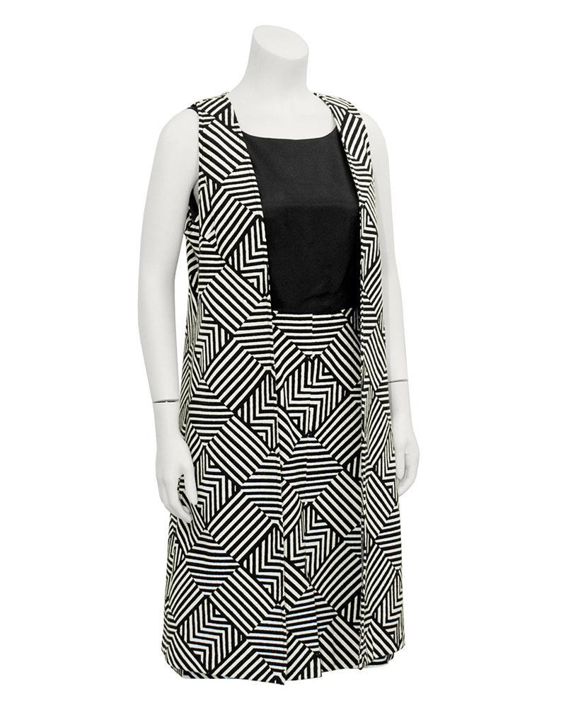 Anonymous Black & White Geometric Set: Eye-catching Mod geometric striped black and white dress and maxi vest from the 1960's. Simple sleeveless sheath dress with a squared neckline, black bodice, fitted waist, and bold softly quilted geom