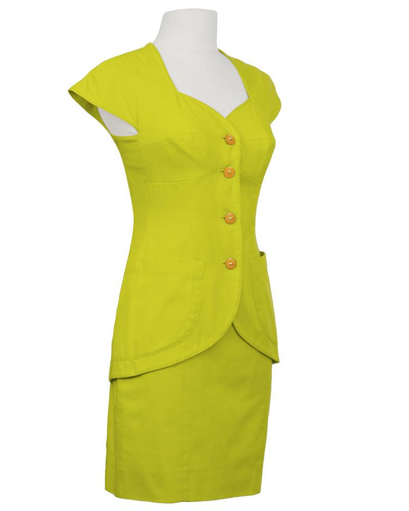 Byblos Green Cotton Short Sleeve Suit Set: Well known 1980's Italian label Byblos chartreuse cotton jacket and skirt set. Dramatic sweet heart neckline with capped sleeves, long line jacket with descending curve to the hem and 2 patch pockets.