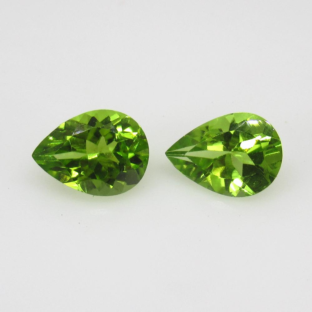 2.42 Ctw Natural Pakistan Peridot Pear Pair: Title: 2.42 Ctw Natural Pakistan Peridot Pear Pair Stone Clarity: VVS Gemstones: Peridot Carat Weights: 2.42 Size/Dimensions: 8.10 x 5.90 x 4.00 mm / 2 PC's Additional Information: Top Class Luster / 