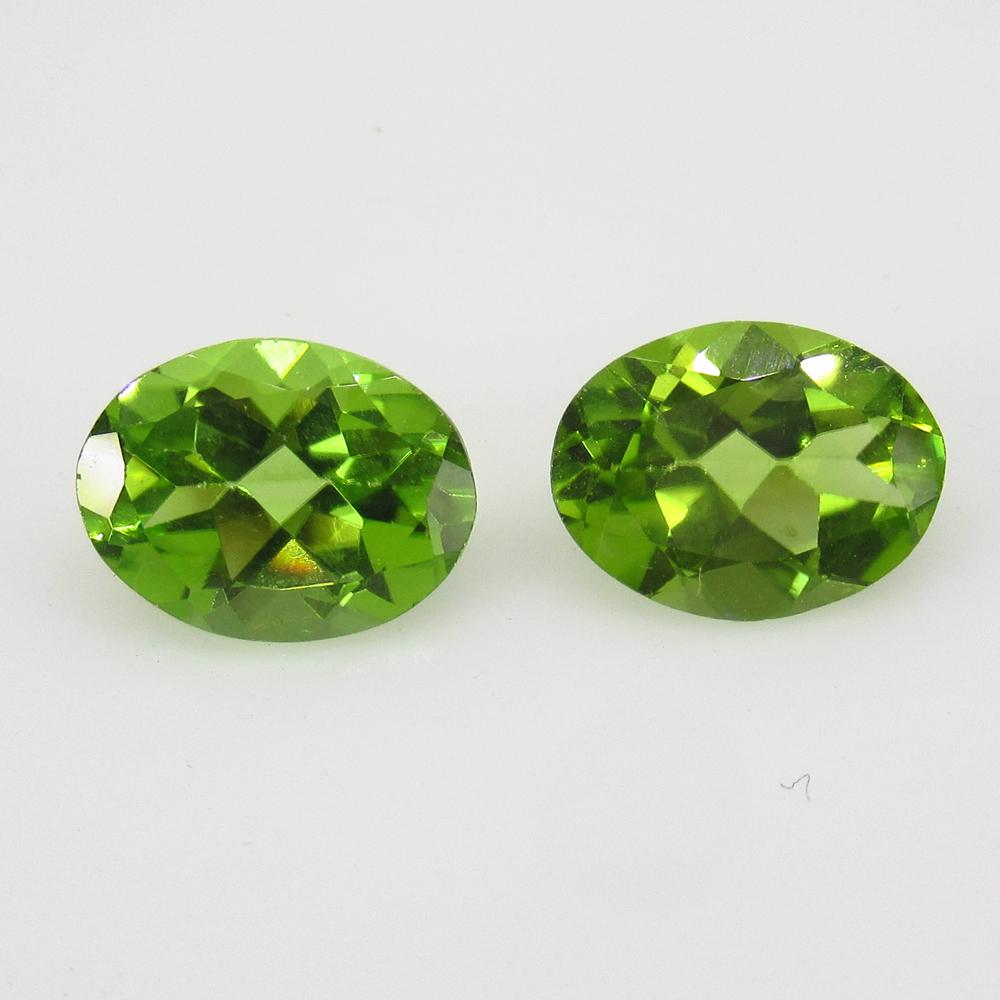 3.34 Ctw Natural Pakistan Peridot Oval Pair: Title: 3.34 Ctw Natural Pakistan Peridot Oval Pair Stone Clarity: VVS Gemstones: Peridot Carat Weights: 3.34 Size/Dimensions: 8.90 x 6.70 x 4.30 mm / 2 PC's Additional Information: Top Class Luster / 