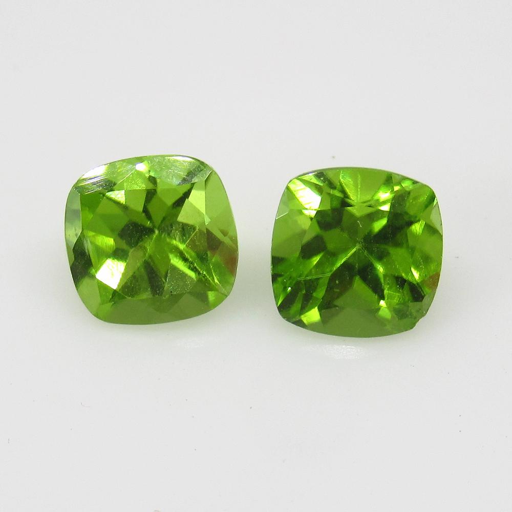 3.29 Ctw Natural Pakistan Peridot Cushion Pair: Title: 3.29 Ctw Natural Pakistan Peridot Cushion Pair Stone Clarity: VVS Gemstones: Peridot Carat Weights: 3.29 Size/Dimensions: 7.00 x 7.00 x 5.00 mm / 2 PC's Additional Information: Top Class Luster