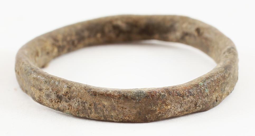 VIKING WEDDING RING, 9TH-10TH CENTURY AD SIZE 14: Cambridgeshire England. Bronze, originally gilt, huge size 14. 3.6mm width with slightly rounded face. Early construction with the band cast with a central core to distribute the metal and heat. The c