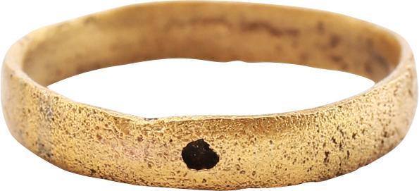 VIKING WOMAN’S WEDDING RING, 10TH-11TH CENTURY AD SIZE: Size 5 ¾. Low rounded band, 3.1mm width. Surface textured from burial. Professionally refurbished with the surface restored in 24 karat gold. Gift boxed with certificate of authenticity. Reserve: $55