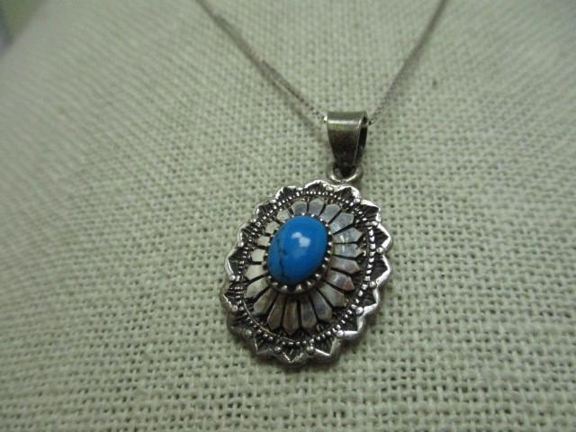 Sterling Silver Southwestern Turquoise Concho Necklace,: Sterling Silver Southwestern Concho with Turquoise Necklace, 18", signed J.C. and Italy on Chain with J.C. It is 5.25 grams in weight. The concho has a wide 1/4" swing bale and is 1" long and 3/4" wid