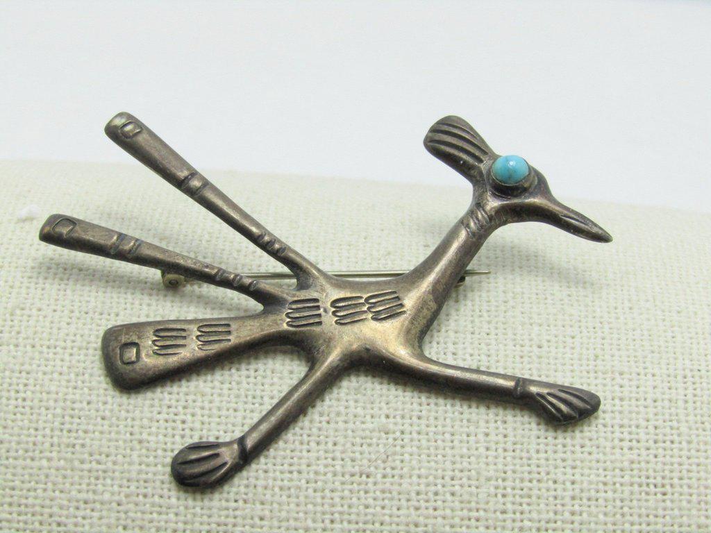 Vintage Southwestern Sterling Roadrunner Brooch,: Vintage Southwestern Sterling Roadrunner Brooch - turquoise snakeye cabochon bezel set. The brooch is likely Navajo/Native American. It is signed Rex with a hand engraving on the back - not sure if Re