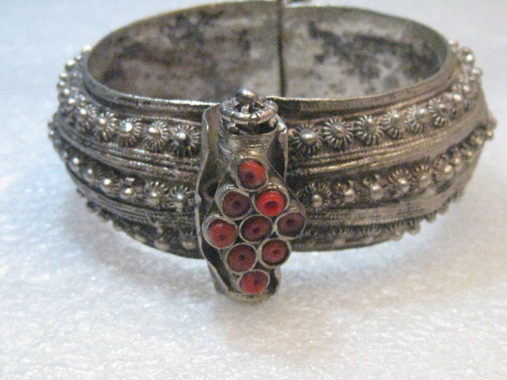 Antique Bedouin/Yemen Silver Bracelet, Screw Toggle,: Antique Beduoin silver cuff bracelet - early 1900's. Coin silver from Australian coins. , 1" wide and 58.62 gr., inside measurement is 6.25", for a slender wrist, signed, and opening is 2.25" by 2". I