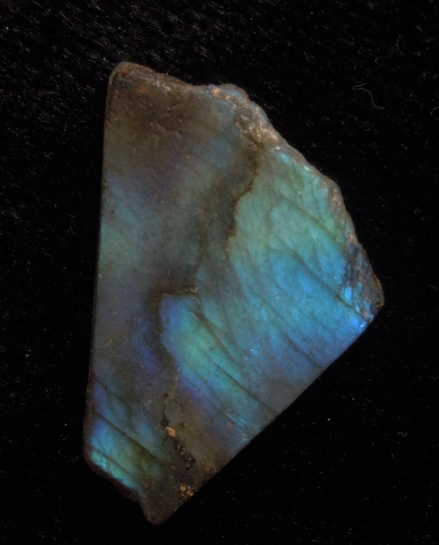 21.05 CT IRIDESCENT LABRADORITE: No Reserve! Title: 21.05 CT IRIDESCENT LABRADORITE Origin: Ampanihy, Atsimo-Andrefana, Madagascar Size: 2.5x2x0.4 cm / 4.21 gram Description: iridescent, multicolor and translucent labradorite Shippin