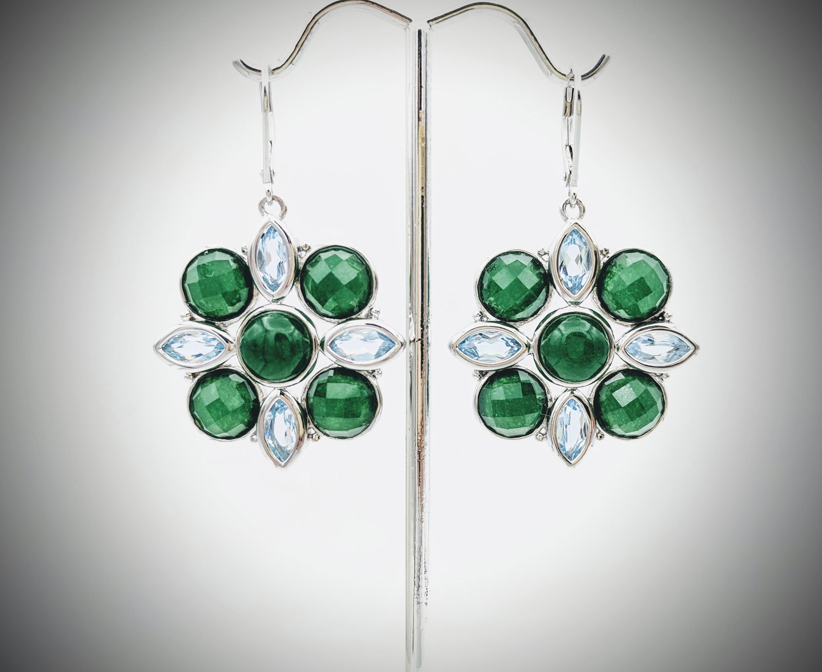 925 SS Green Jadeite w Sky Blue Topaz Earrings: Title: 925 SS Green Jadeite w Sky Blue Topaz Earrings Brand: Jean Lin Collection Metal Purity:925 Sterling Silver Gemstones:Green Jadeite w Sky Blue Topaz Carat Weights:Each Earring has 5 Round Jadeit