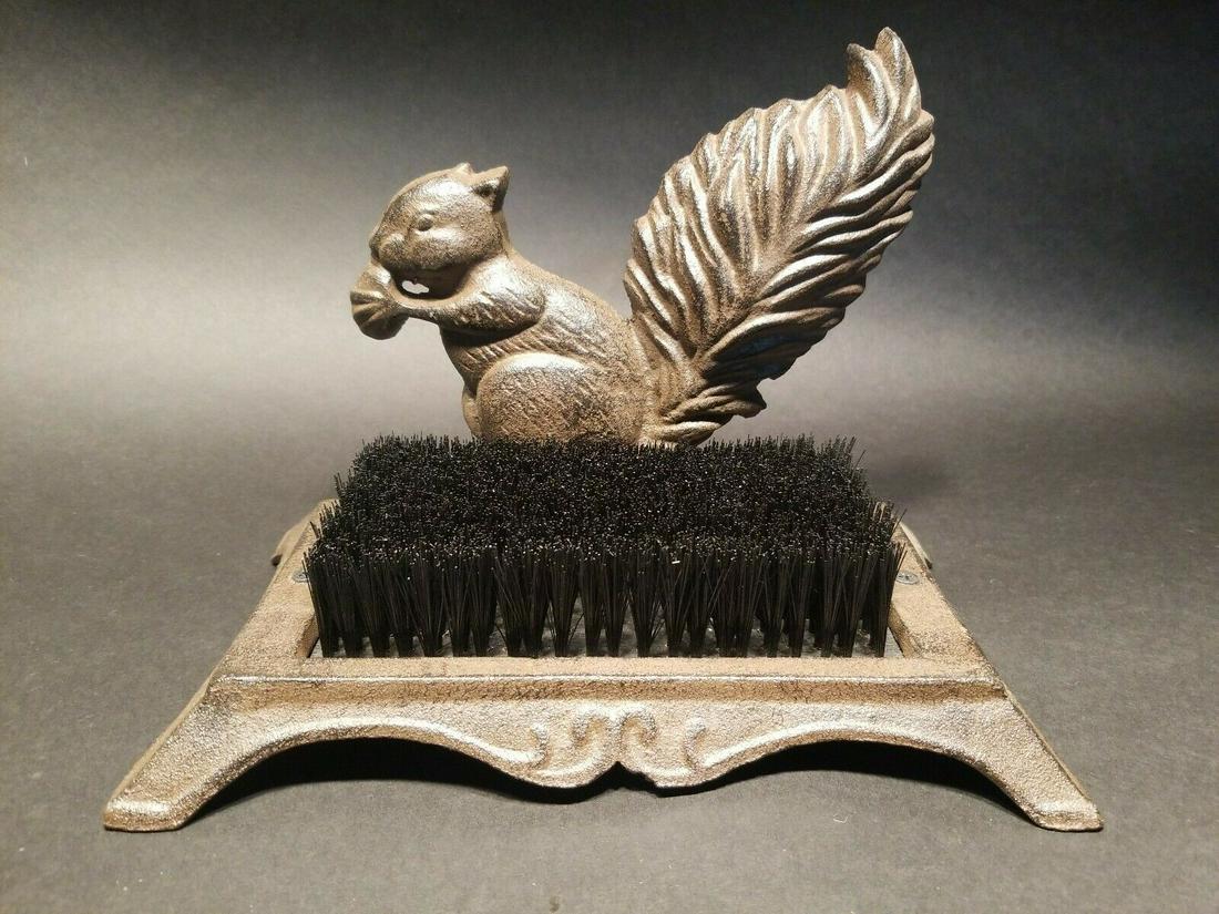 Cast Iron Squirrel Boot Shoe Brush: 10" Long 6 1/4" Wide 7 1/4" tall Such a creative reproduction cast iron squirrel shoe brush. As you might imagine this is not only a great decoration for the entrance it is great for brushing off your