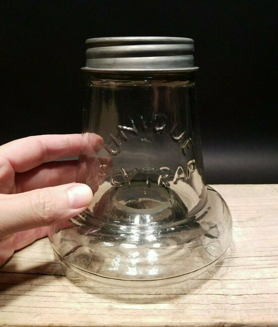 Table Top Footed Glass Wasp Fly Bug Trap Jar: 6 1/4" High jar x 5 3/8" Wide Great reproduction of a glass table top fly trap. As you can see the heavy glass jar has a metal top and is slightly raised from the bottom with a hole on the under side.