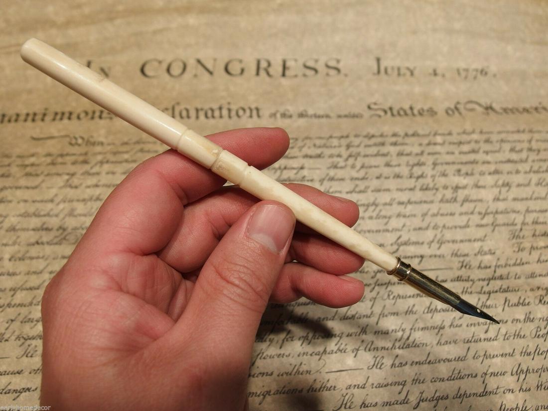 Turned Bone Calligraphy Inkwell Ink Dipping Pen: 7 1/2" Long Great reproduction of an antique turned bone dipping pen. Made from natural bovine cattle bone. This piece accommodates the included removable metal tip. And finely turned bone handle. Cer