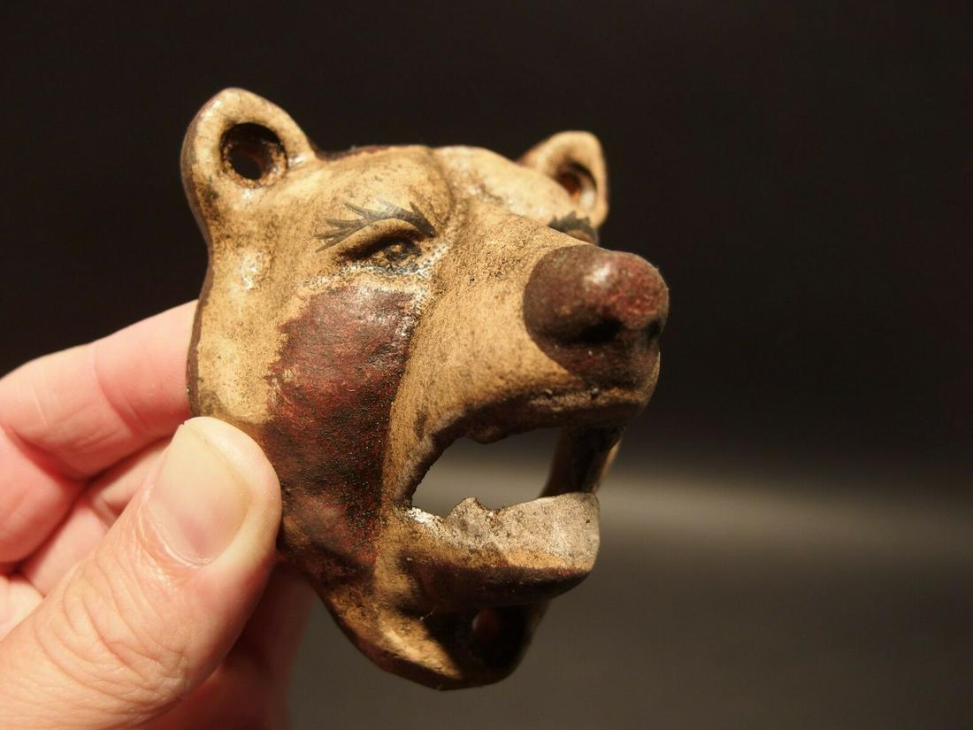 Cast Iron Wall Mount Figural Bear Beer Bottle Opener: 3 1/2" Tall x 2 3/4" Wide Great reproduction cast iron bottle opener. This piece was made to look just like an antique, but is new. Reserve: $15.00 Shipping: Domestic: Flat-rate of $8.00 to anywhere w