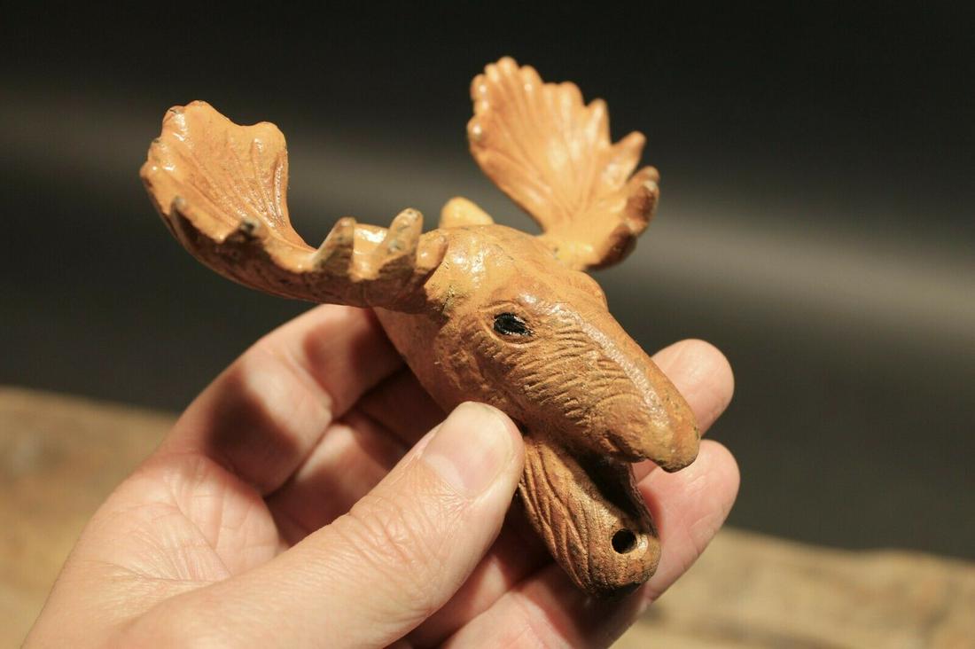 Cast Iron Painted Moose Wall Mount Beer Bottle Opener: 4 1/4" Tall x 4 1/4" Wide Great reproduction cast iron bottle opener. This piece was made to look just like an antique, but is new. Reserve: $17.00 Shipping: Domestic: Flat-rate of $8.00 to anywhere w