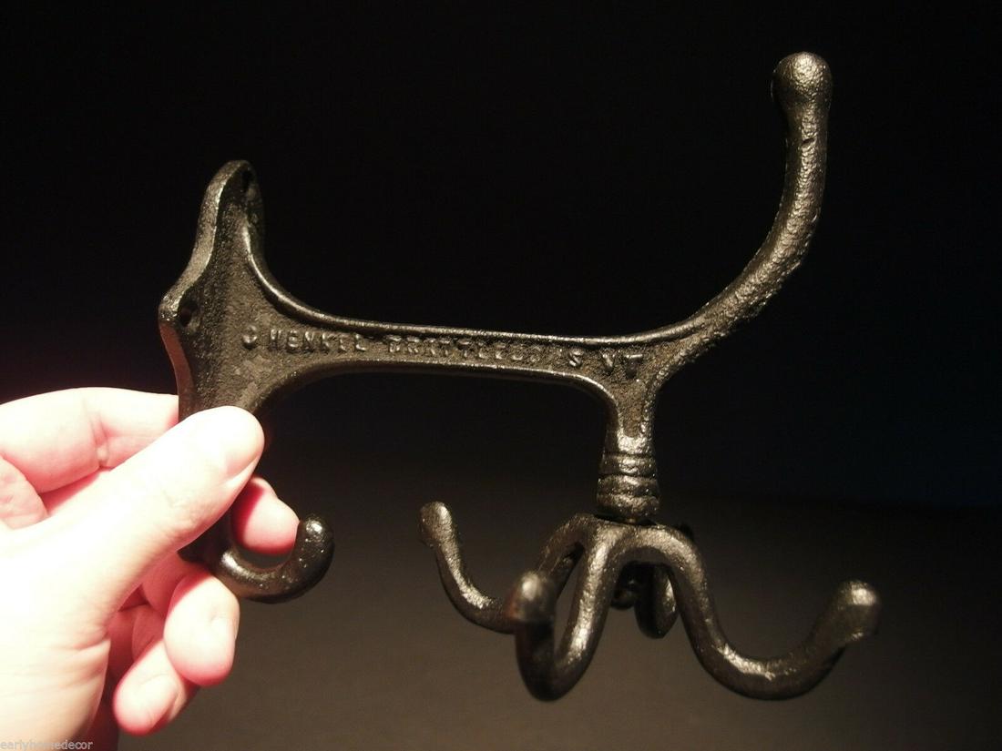 BLACK Cast Iron Hook Rotating Bracket Spinning Coat: (1) Hook 6" Tall.. 4 1/4" Wide 6" Extension 1 Charming and functional sturdy iron wall hook cast from an antique. Notice the 4 fully rotating bottom hooks. All Heavy cast iron.... Cast hook reads: Hen