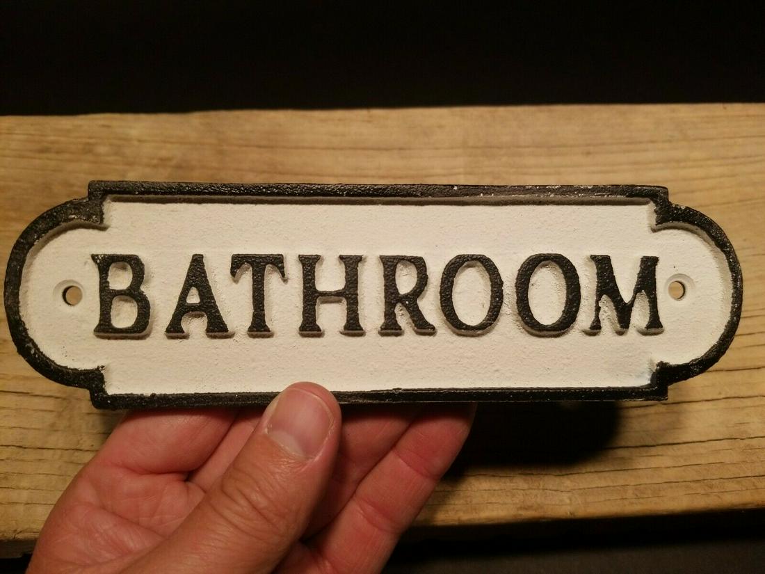 Cast Iron Bathroom Sign: 7 1/4" long x 2 1/8" tall A wonderful reproduction cast iron "BATHROOM" sign plaque. As you can see these were hand painted and slightly distressed to look old. Reserve: $15.00 Shipping: Domestic: Fla