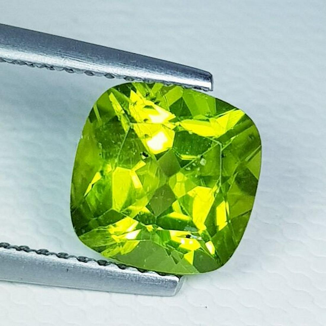 2.45 ct Natural Peridot Cushion Cut: No Reserve! Title: 2.45 ct Natural Peridot Cushion Cut Color/Clarity: VVS Carat Weight: 2.45 Size/Dimensions: 8.00 x 8.00 x 5.20 Additional Information: Cushion - Pakistan Shipping: Domestic: Flat-rat
