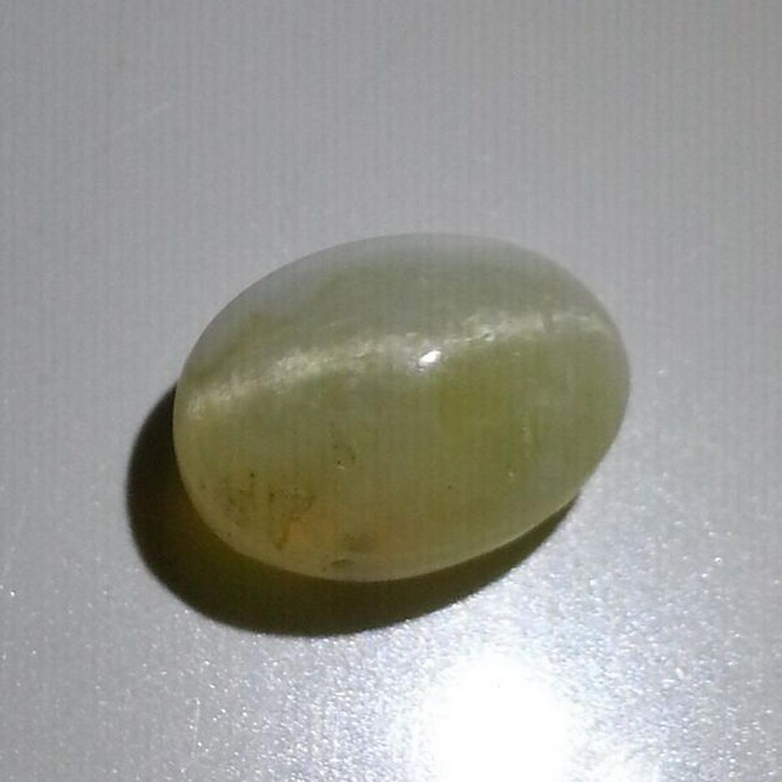 5.89 ct Natural Opal Cat's Eye: No Reserve! Title: 5.89 ct Natural Opal Cat's Eye Color/Clarity: Semi Transparent Carat Weight: 5.89 Size/Dimensions: 13.00 x 9.40 x 8.60 Additional Information: Oval - Africa Shipping: Domestic: Flat