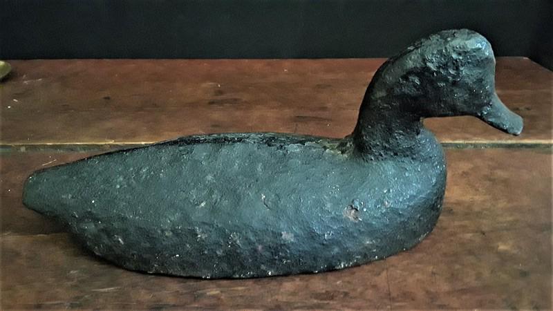 Rare Cast Iron Sinkbox Duck Decoy: Title: Rare Cast Iron Sinkbox Duck Decoy Provenance: A sinkbox is a specialized hunting blind, resembling a raft, used by waterfowl hunters. It consists of a weighted, partially submerged enclosure la