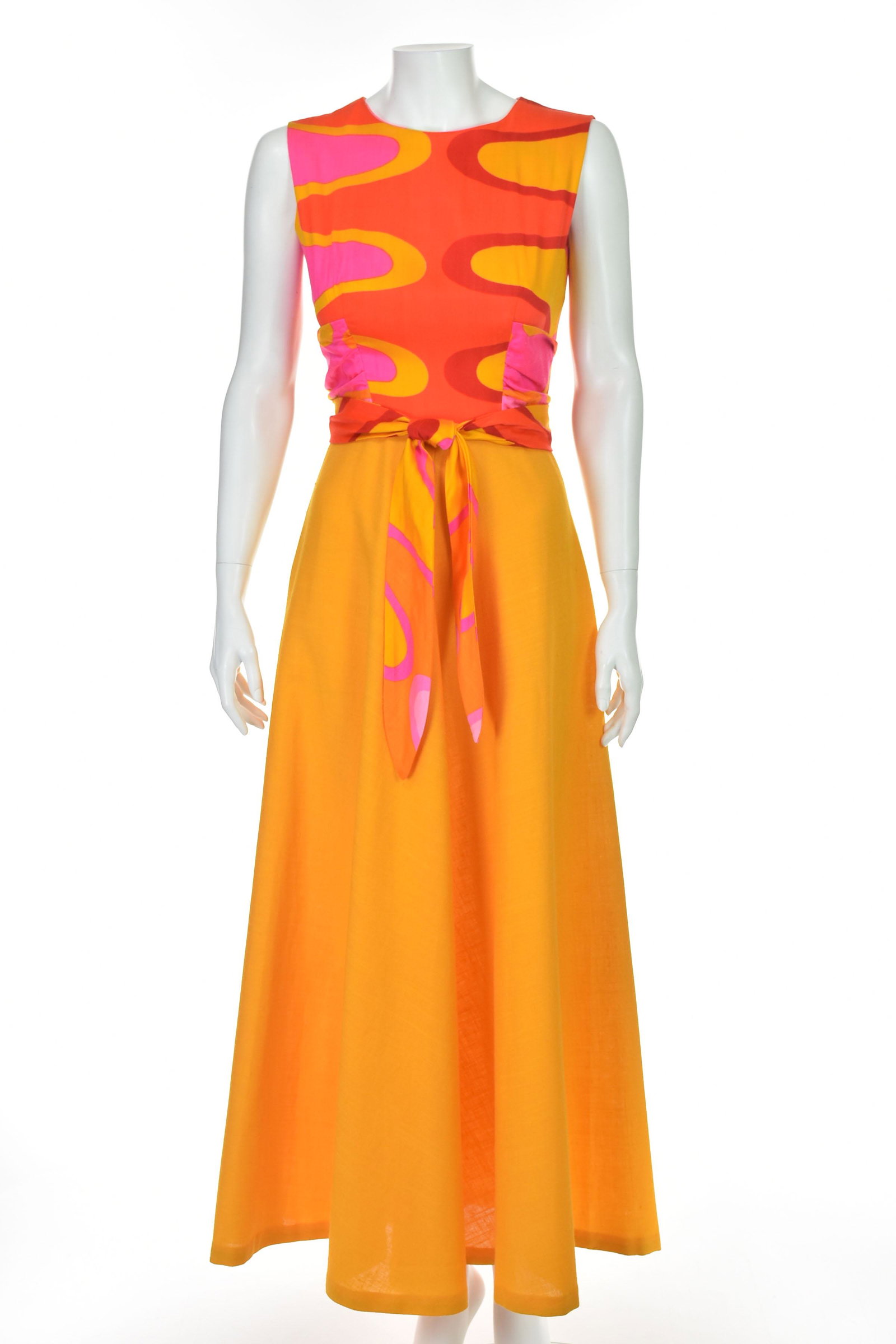 ALICE of CALIFORNIA 1960s Mod Maxi Dress: With its brightly colored, Mod pattern, sashes that wrap around the waist, and long flared skirt, this is a quintessentially 1960s style maxi dress. According to the fabric label, the top is acrylic -
