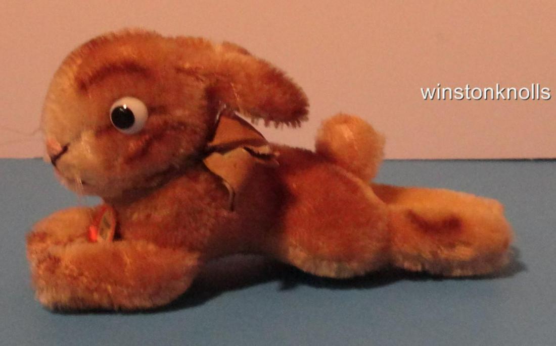 1959 STEIFF SMALL LYING RABBIT BLOWN GLASS EYES PAPER: 1959 STEIFF SMALL LYING RABBIT BLOWN GLASS EYES PAPER TAG READS ORGINIAL STEIFF Description STEIFF 1959 2309,00 OR 2312,00 12 CM 5 1/2 inches TIP TO TIP OF TOES ORIGINAL BLUE GREY RIBBON LYING RABBIT 