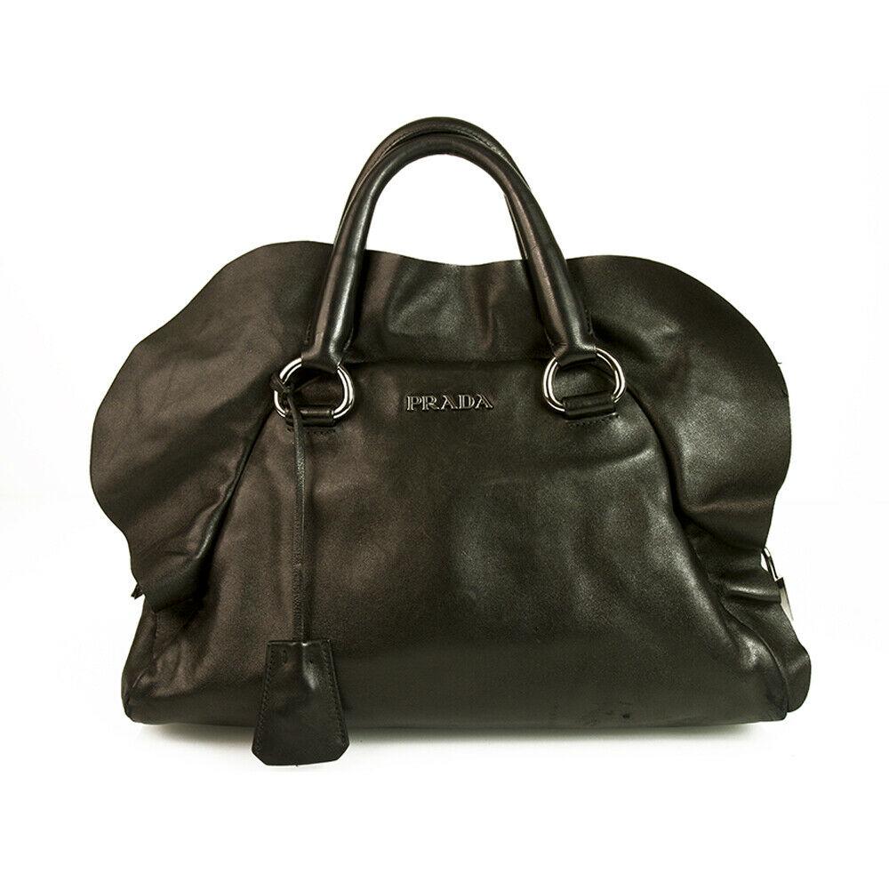 Prada Black Nappa Ultra Soft Leather Ruffle Bauletto: Prada Black Nappa Ultra Soft Leather Ruffle Bauletto Bag Top Handle Handbag This chic Prada Leather Medium Ruffle Bag makes a perfect everyday carryall! Black ultra soft nappa leather with gunmetal ha
